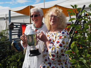 The Mike Hough memorial trophy held by Carol and Chris